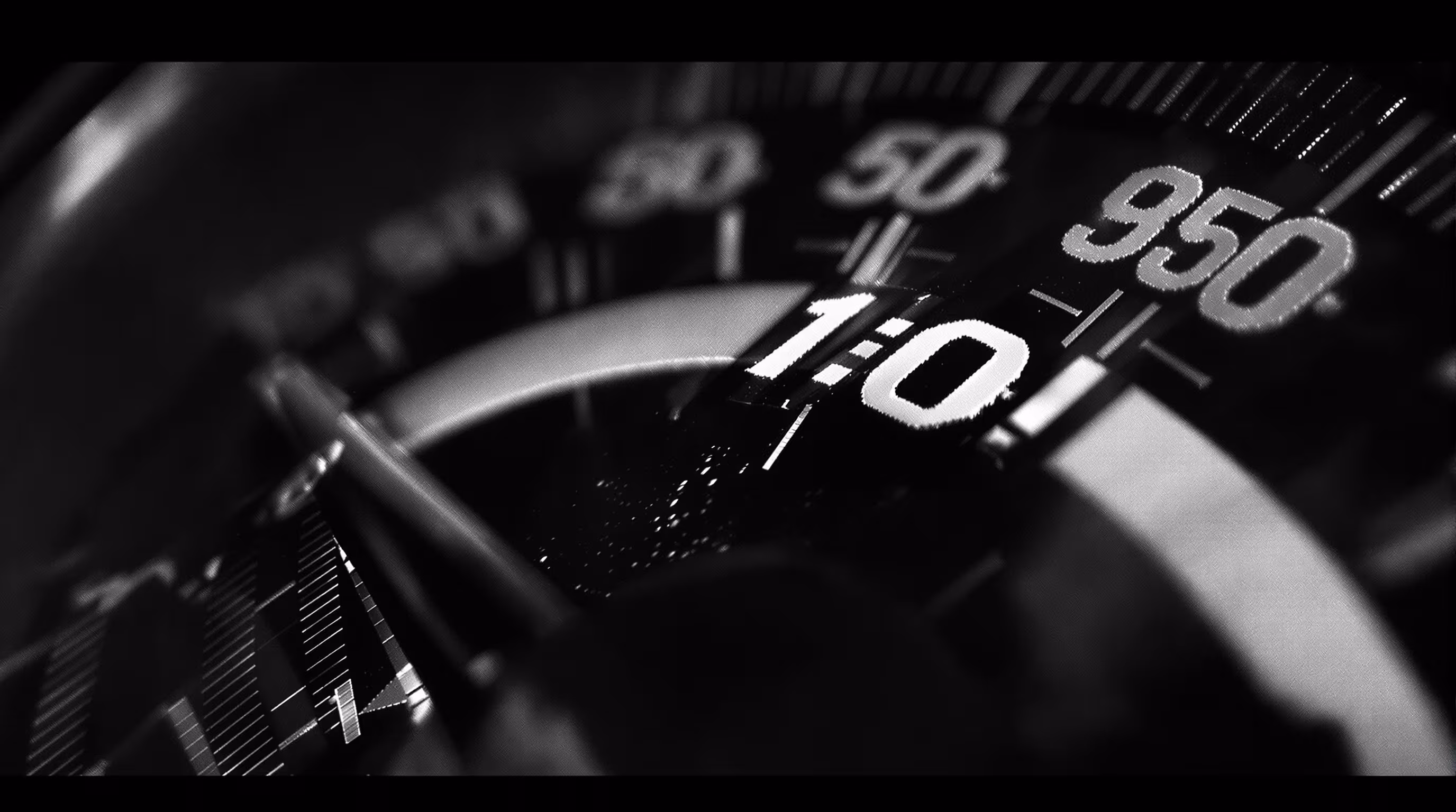 Macro of an analogue odometer dial, digit drums caught mid-rotation.